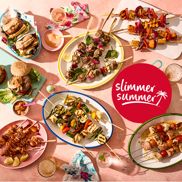 Spread of Slimming World barbecue food including burgers, veggie burgers and kebab skewers