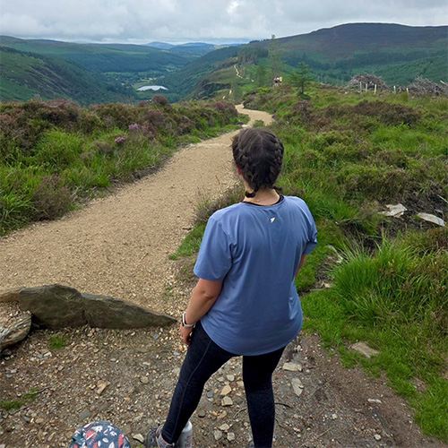 Slimming World Consultant Rebecca walking along a country path.