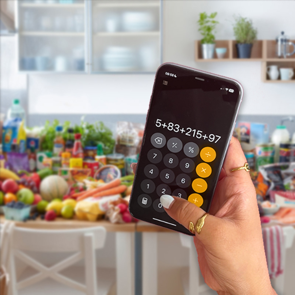 iPhone being held up and showing the calculator app with the sums 5+83+215+97